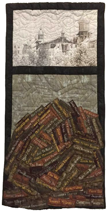 Quilt with an image of a building - below is a stack of bricks with names